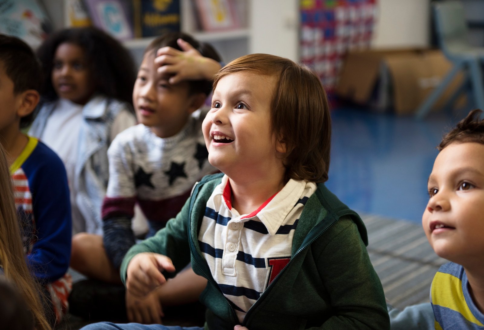 Kindergarten students sitting on the floor